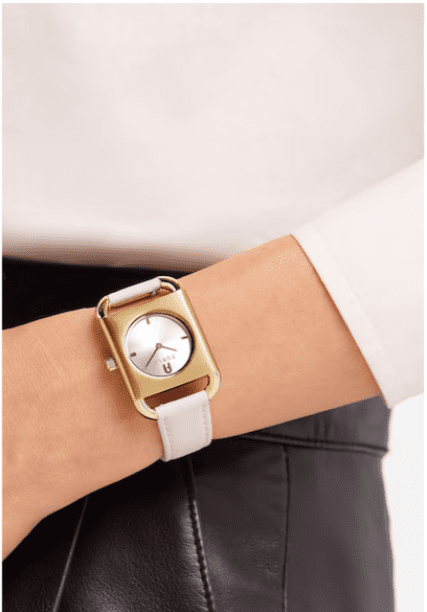 gold watch matching beige outfit